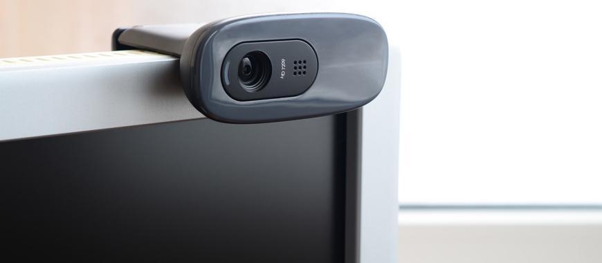 a-modern-web-camera-is-installed-on-the-body-of-a-flat-screen-monitor-device-for-video-communication